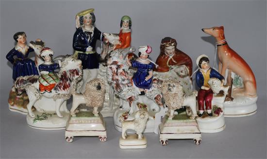 A pair of small Staffordshire poodles, six other Staffordshire figures, a flatback and an inkwell (faults)